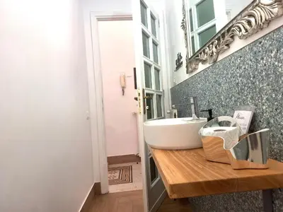 a bathroom with a sink and a mirror at Porta Labicana House -10 minutes from Termini Station in Rome