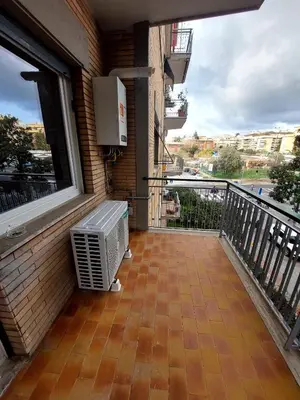 a balcony with an air conditioner on the side of a building at casa gemelli vaticano roma in Rome