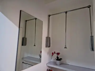 a bathroom with two mirrors and a sink at Tiburtina Keys - Roma in Rome