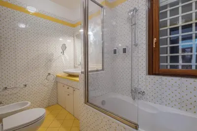 a bathroom with a shower and a tub and a toilet at Da Cecilia alla Piramide Cestia in Rome