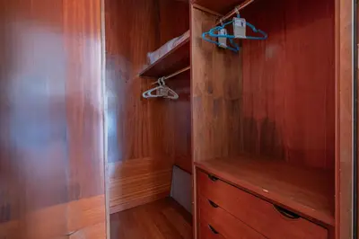 a walk in closet with wooden walls and wood floors at Da Cecilia alla Piramide Cestia in Rome