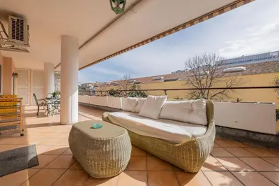 a living room with a couch on a balcony at Da Cecilia alla Piramide Cestia in Rome