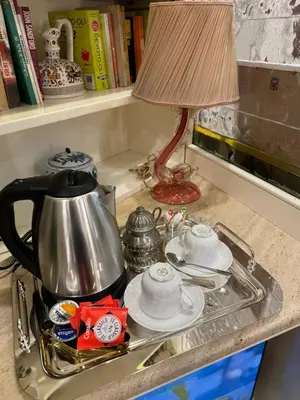 a tea pot and a lamp on a kitchen counter at ad vatican luxury apartment in Rome