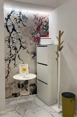 a room with a table and a painting on the wall at Dielle Suite ROMA in Rome