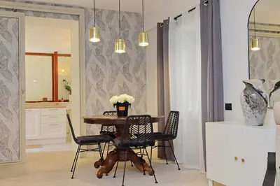 a dining room with a table and chairs at 4BNB - Ponte Milvio Apartment in Rome