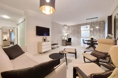 a living room with a couch and a table at 4BNB - Ponte Milvio Apartment in Rome