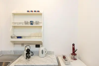 a kitchen with a counter top with a sink at Amazing Elegant Jewish Ghetto in Rome