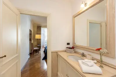 a bathroom with a sink and a mirror at Amazing Elegant Jewish Ghetto in Rome