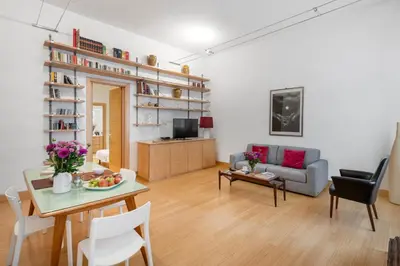 a living room with a couch and a table at Beige luxury apartment Rome in Rome