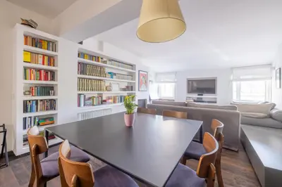 a dining room with a table and chairs at Farnesi Terrace Penthouse in Rome