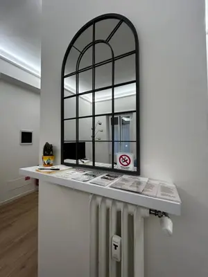 a mirror on a counter in a room at flaTminio modern & nice apartment in Rome