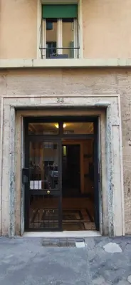 an entrance to a building with a glass door at flaTminio modern & nice apartment in Rome