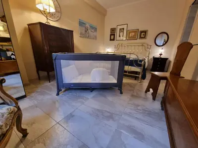 a living room with a large tv on the floor at Happy Home Piramide Cestia Lussuoso Unico Esclusivo a Roma in Rome