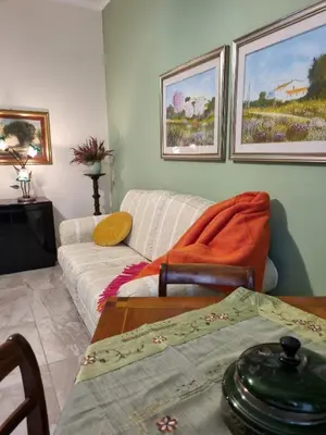 a living room with a couch and a table at Happy Home Piramide Cestia Lussuoso Unico Esclusivo a Roma in Rome