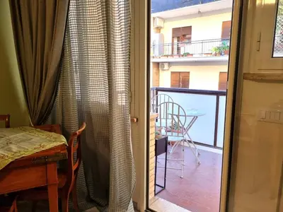 a door to a balcony with a view of a balcony at Happy Home Piramide Cestia Lussuoso Unico Esclusivo a Roma in Rome