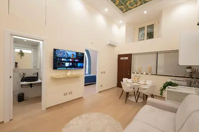 a living room with a couch and a table at Colosseo Romantic Suite in Rome