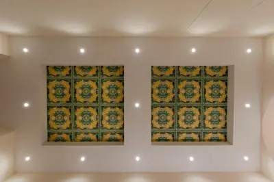 two paintings on a wall in a room at Colosseo Romantic Suite in Rome