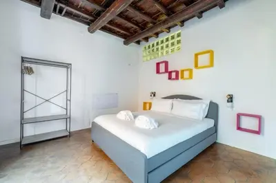 a bedroom with a large bed in a room at maison pelliccia in Rome