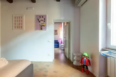 a toy of a child in a room with a toilet at maison pelliccia in Rome