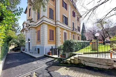 a large house with a gate in front of it at Vatican apartment with parking in Rome
