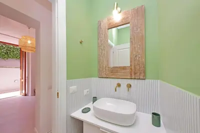 a bathroom with a white sink and a mirror at Vatican apartment with parking in Rome