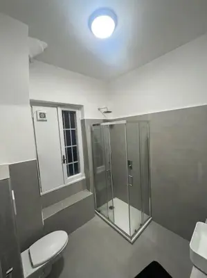 a bathroom with a toilet and a shower and a sink at Apartment V12 in Rome