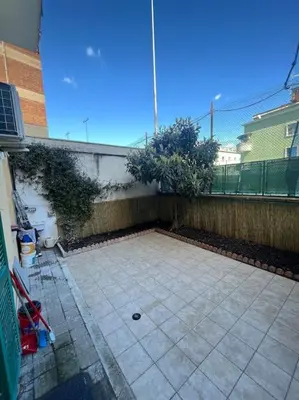 an empty patio with a fence and trees on it at Apartment V12 in Rome