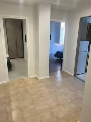 an empty room with a kitchen and a living room at Apartment V12 in Rome
