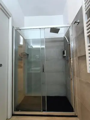 a shower with a glass door in a bathroom at viaCatania16 in Rome