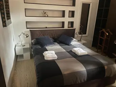 a bedroom with a large bed with towels on it at Trastevere Charme in Rome