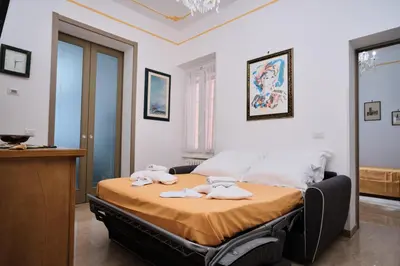 a bedroom with a bed with towels on it at MAJOR DOMUS 501 in Rome