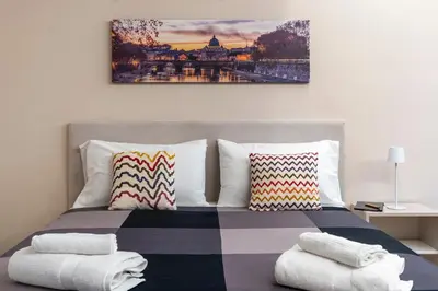 a bedroom with a bed with towels on it at Le stanze sui musei vaticani in Rome