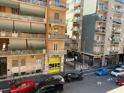 an aerial view of cars parked in front of a building at Bright apartment near San Pietro in Rome