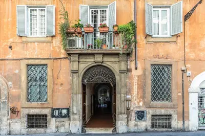 an entrance to a building with a balcony at iFlat Elegant 3 bedroom apt near the Pantheon in Rome
