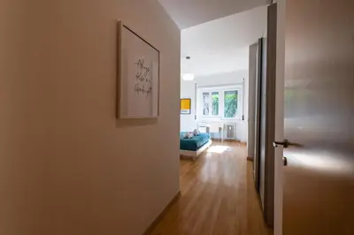 a hallway with a door leading to a living room at Leoncavallo Retreat in Rome