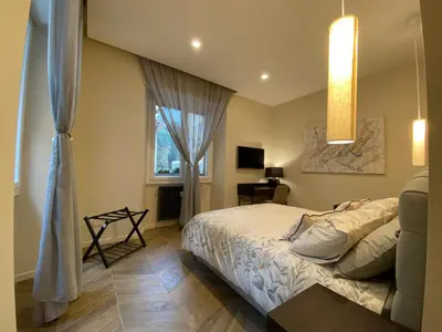 a bedroom with a bed and a window at Ghirlanda House in Rome