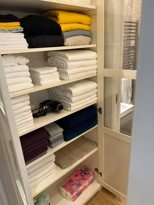 a closet filled with lots of towels at Aurelius Holiday Home in Rome