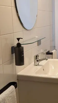a bathroom with a sink and a mirror at Euforia House in Rome