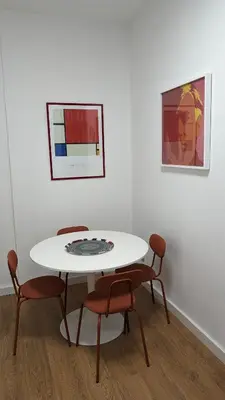 a white table and chairs in a white room at Euforia House in Rome