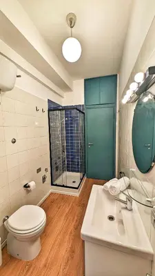a bathroom with a toilet and a sink and a shower at Euforia House in Rome