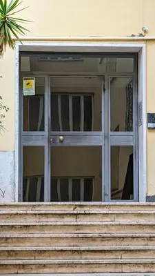 a door with stairs in front of a building at Euforia House in Rome