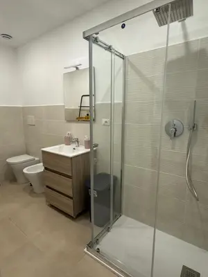 a bathroom with a shower and a sink and a toilet at Sweet House via dei gracchi in Rome