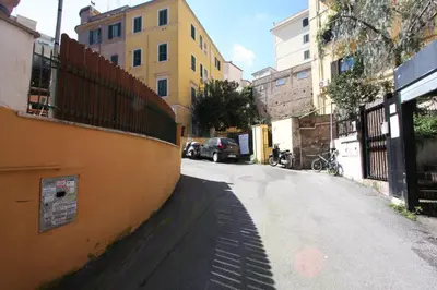 an empty street in an alley with buildings at Sara Holiday House in Rome