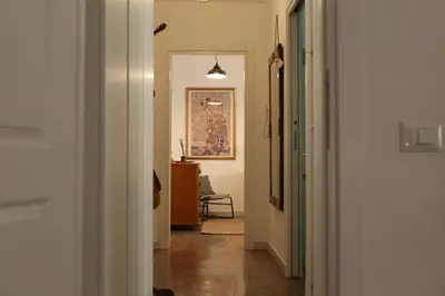 a hallway with a hallway leading into a room at Porta Maggiore Modern Apartment in Rome