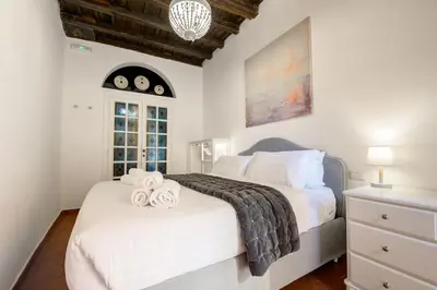 a bedroom with two beds with towels on them at Pantheon Boutique Apartment in Rome