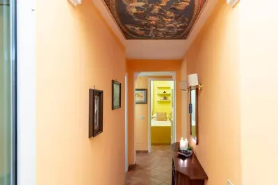 a hallway with orange walls and a ceiling at Casa Rio by Hili in Rome