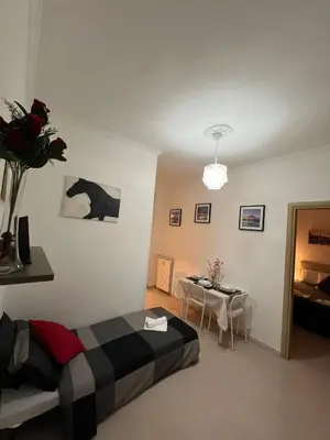 a bedroom with a bed and a table in it at centro stazione tuscolana in Rome