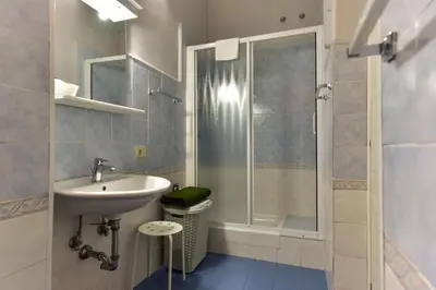 a bathroom with a sink and a shower at Best Rooms Termini in Rome