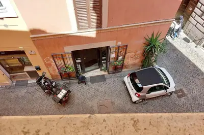 an aerial view of two cars parked in front of a building at Appartamento 