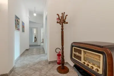 a room with an old radio and a fire extinguisher at Tomo Apartment St. Peter's in Rome